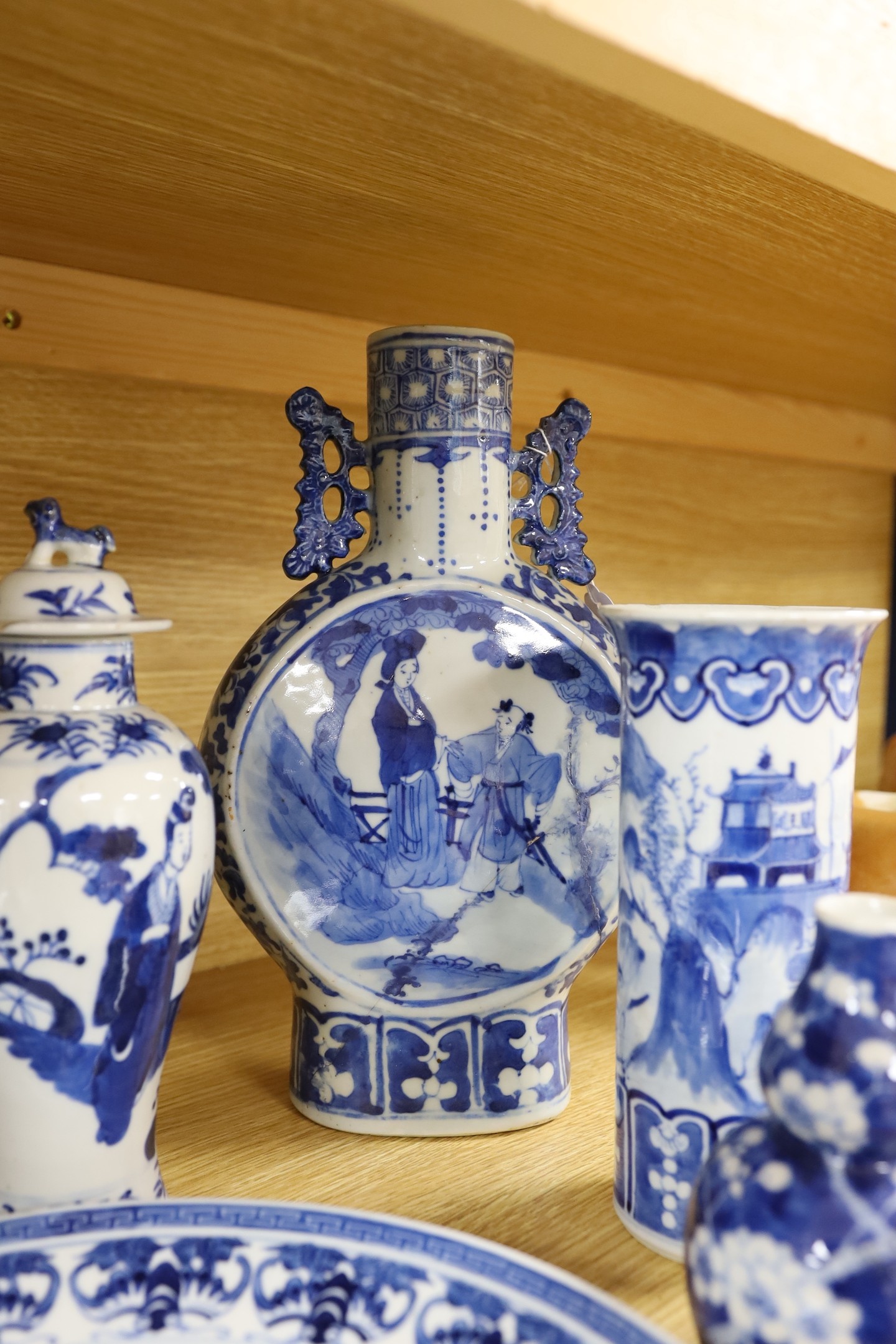 A collection of mixed 19th century Chinese blue and white porcelain to include a dish decorated with characters, other blue and white wares (some with damage). 29.5cm tall